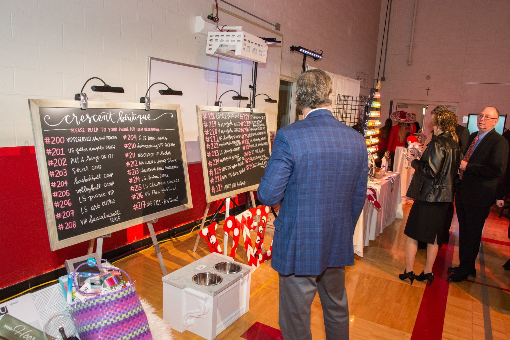 Guests look at the items up for auction